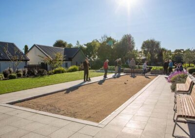 People playing bowls outside