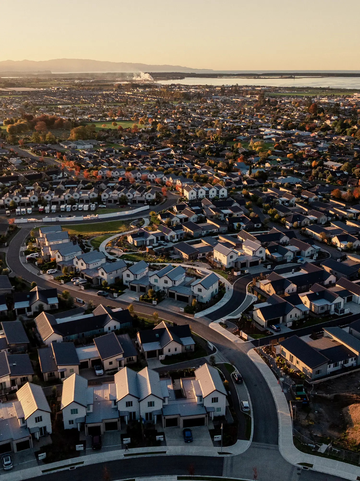 Aerial view of the Nelson/Tasman region overlooking Olive Estate Lifestyle Village toward the coast.