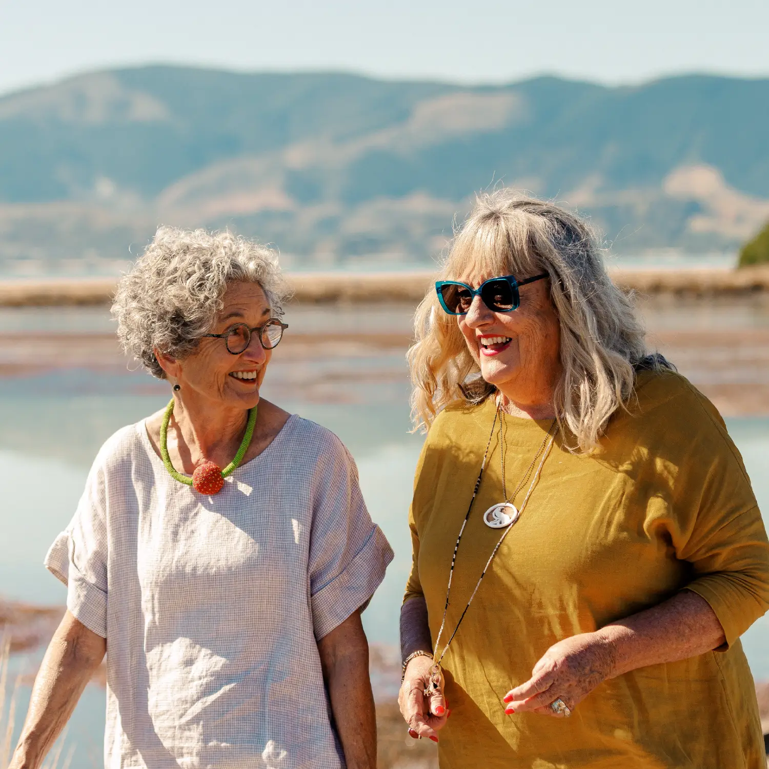 Two older women walking along the Great Taste Trail near Olive Estate Lifestyle Village in the Nelson/Tasman region.