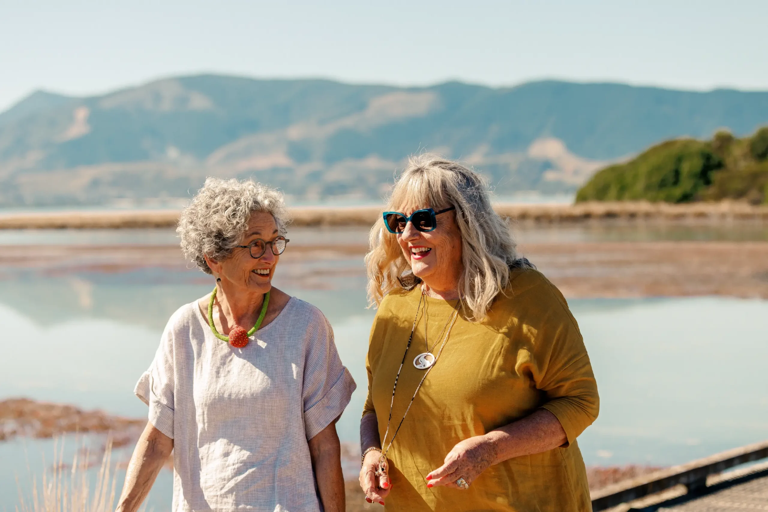 Two older women walking along the Great Taste Trail near Olive Estate Lifestyle Village in the Nelson/Tasman region.
