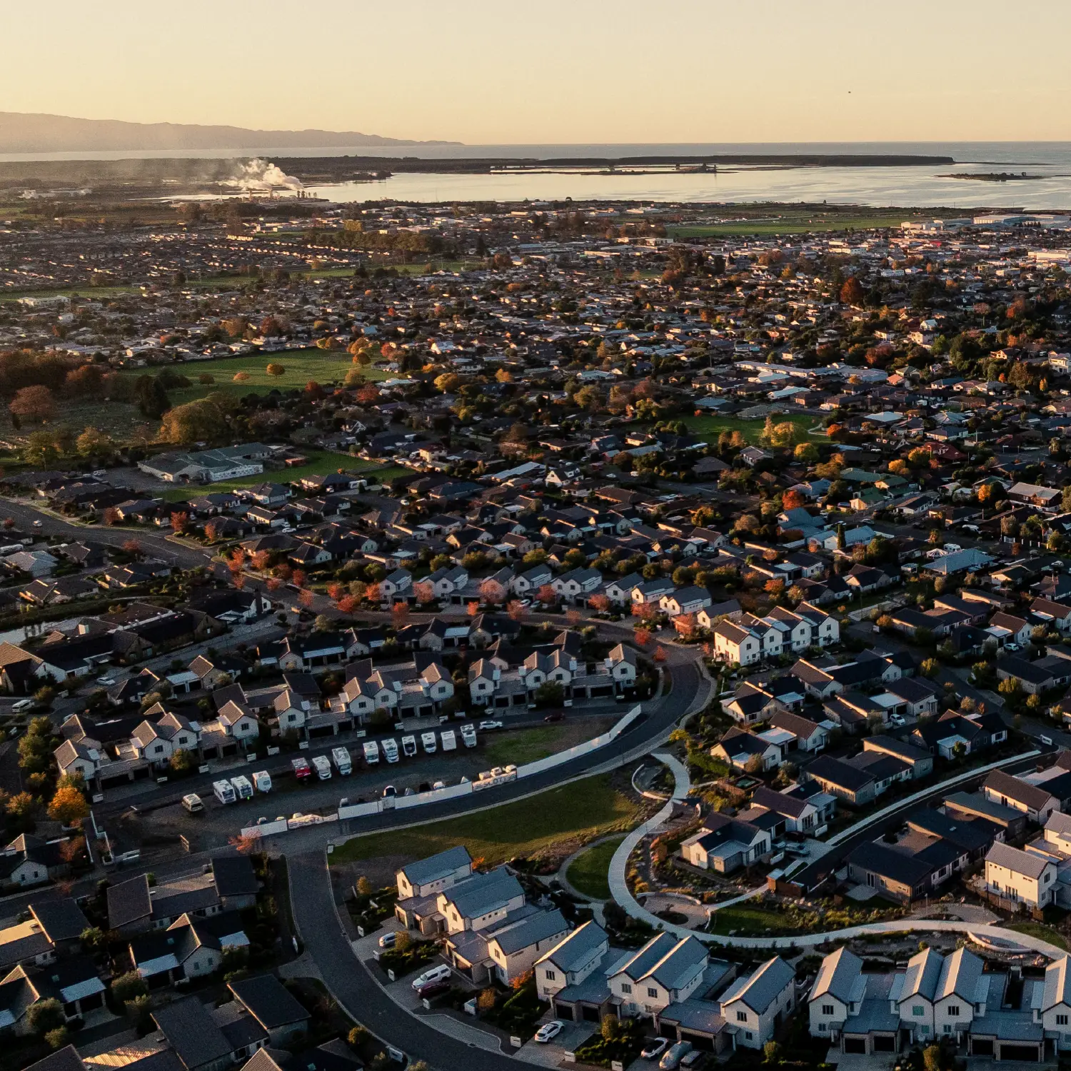 Aerial view of the Nelson/Tasman region overlooking Olive Estate Lifestyle Village toward the coast.