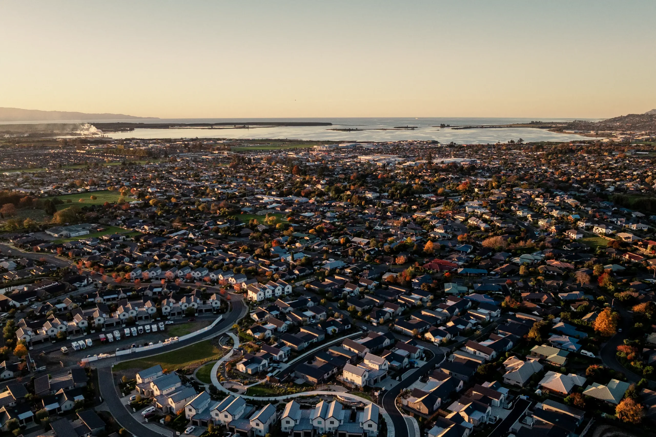Aerial view of the Nelson/Tasman region overlooking Olive Estate Lifestyle Village toward the coast.